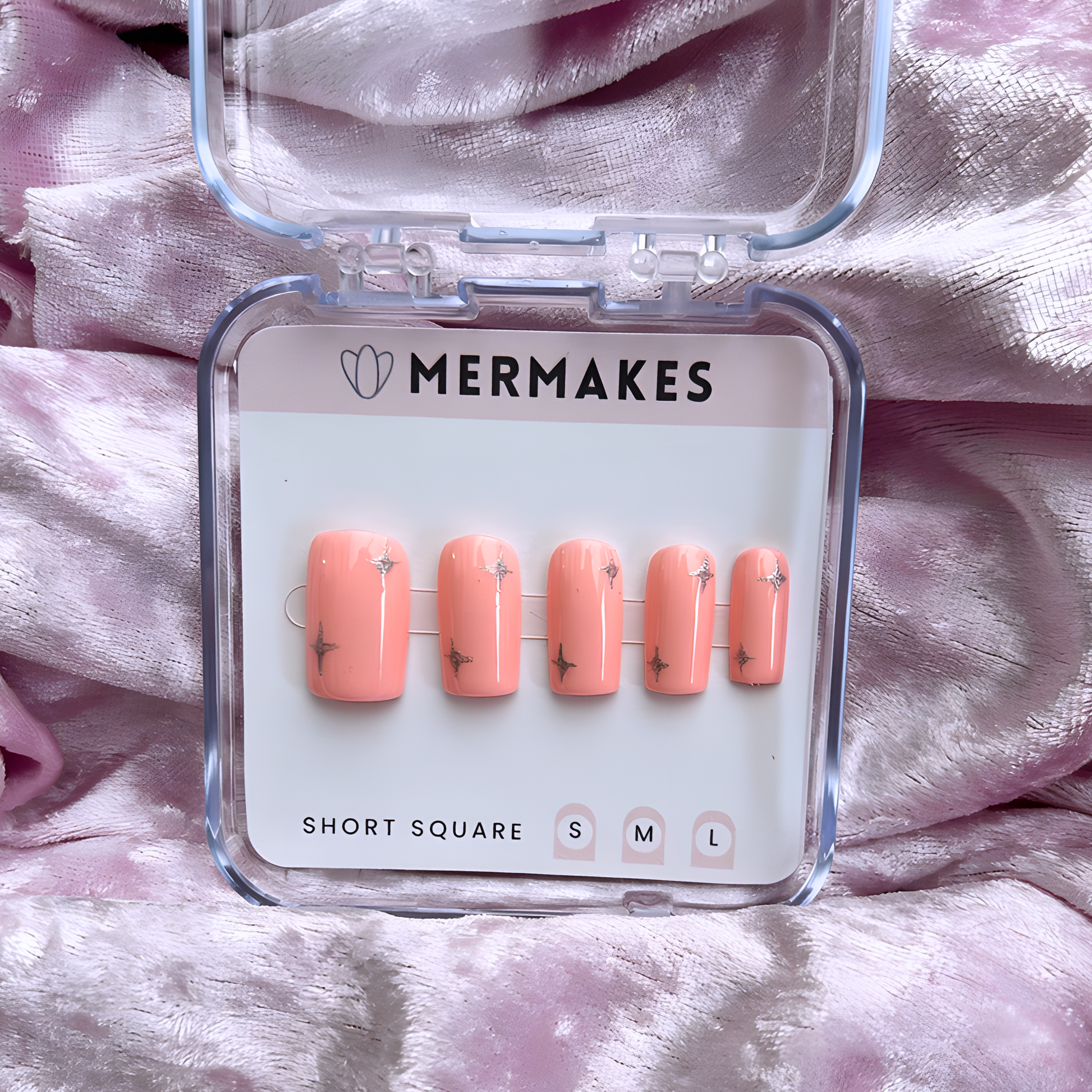 coral pink nail set with silver stars